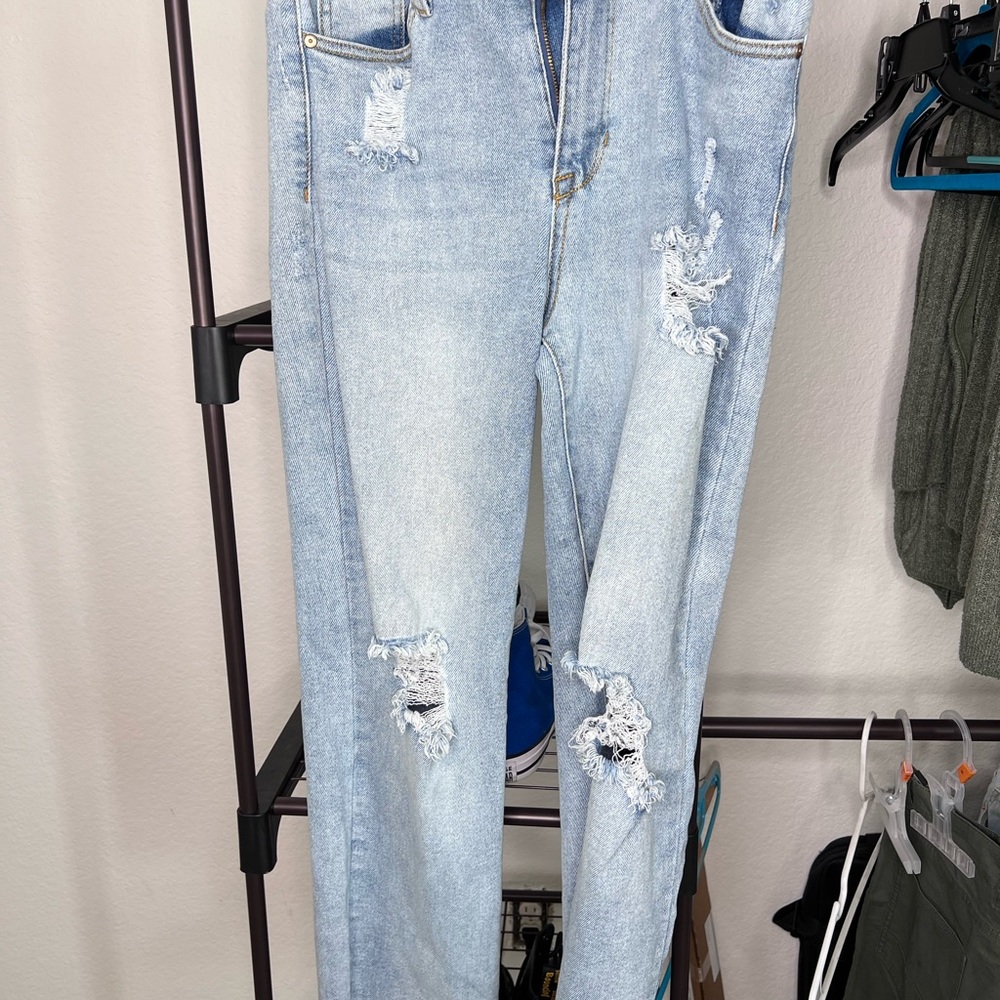 Ripped light blue jeans